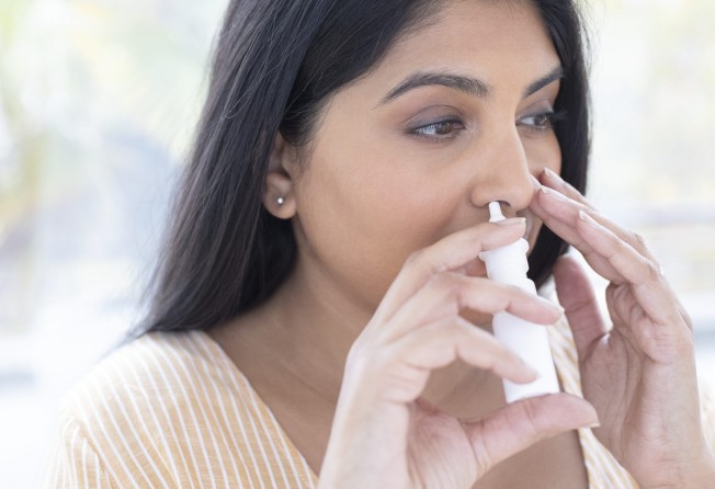 A nasal spray might more accurately mimic the natural protection a person gains from a recent infection. Photo: Getty Images
