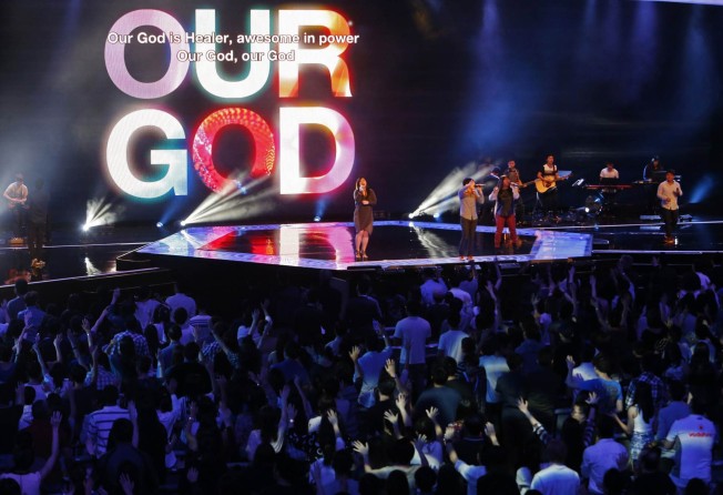 Worshippers attend a service at the City Harvest Church, a Pentecostal megachurch in Singapore, in 2014. Photo: Reuters
