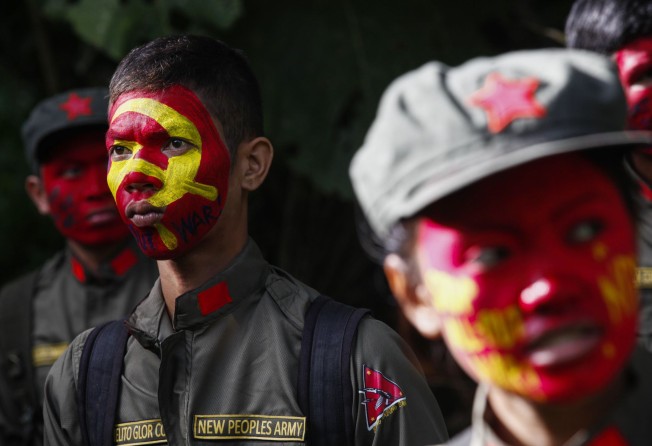 Young fighters of the New People’s Army, the armed wing of the CPP, at the Sierra Madre mountains of Luzon region. File photo: EPA