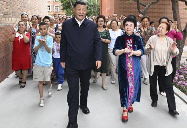 Xi Jinping visits the community of Guyuanxiang in Urumqi. Photo: AP