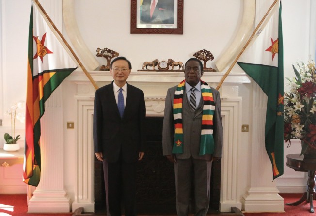 Zimbabwean President Emmerson Mnangagwa with Yang Jiechi in Harare on July 3. Photo: Xinhua