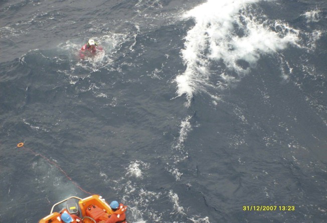 One of the crew of Lee’s boat being rescued. Photo: Carolyn Lee