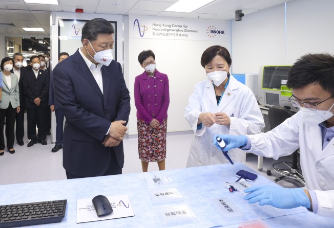 President Xi Jinping visits the Hong Kong Center for Neurodegenerative Diseases on June 30 during a tour of Hong Kong Science Park with then chief executive Carrie Lam. Photo: Xinhua