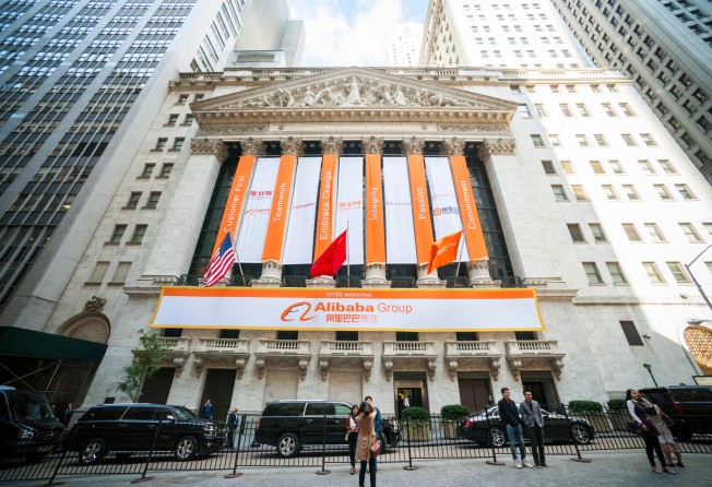 Visitors are seen outside the New York Stock Exchange building on September 19, 2014, when the Chinese e-commerce giant started its first day of trading after raising US$25 billion from its initial public offering. Photo: Shutterstock