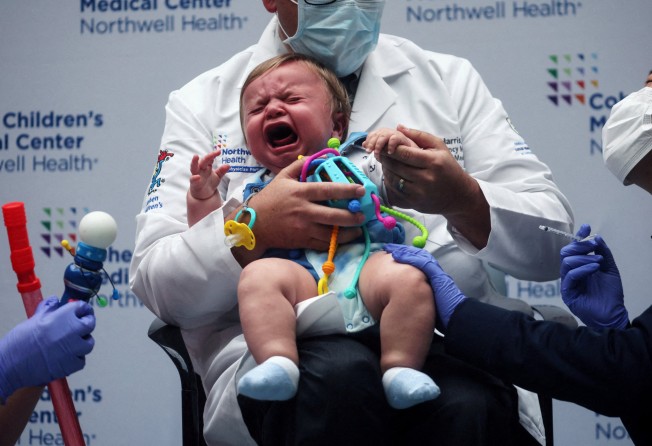 A nine-month-old baby receives a coronavirus jab in the US. Photo: Reuters