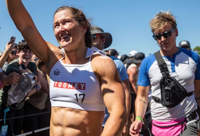 Tia-Clair Toomey waves to the fans at the 2022 CrossFit Games on day 3.