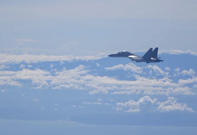 Xinhua released images that appeared to show a plane flying near the Taiwanese coast. Photo: AP