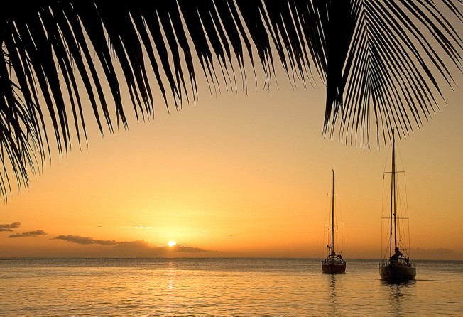 The sun setting in the Dominica. Photo: Shutterstock