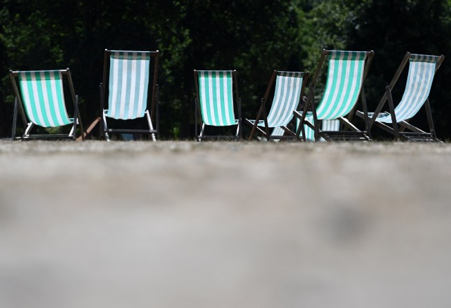 Deck-chairs sit empty in the heat at Green Park in London. The UK Met Office has announced an amber alert for extremely hot weather. Photo: EPA-EFE