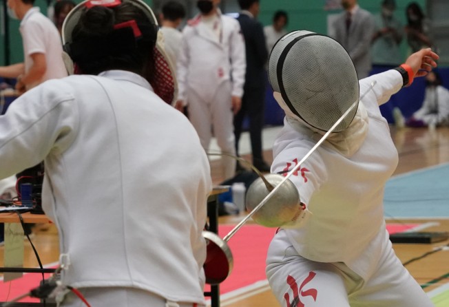 Kaylin Hsieh Sin-yan (right) in action at the LCSD Open Fencing Championships at Hong Kong Park Sports Centre. Photo: Felix Wong
