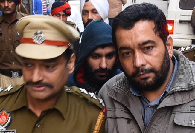 British Sikh man Jagtar Singh Johal, centre, being escorted to a court in India in 2017 after being arrested when he arrived in the country for his wedding. Photo: AFP