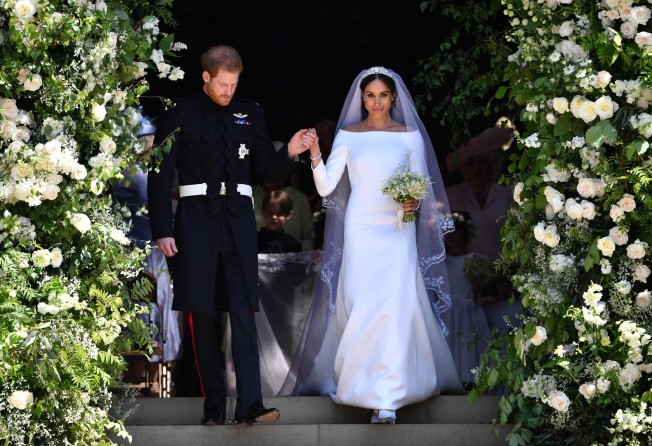 Britain’s Prince Harry, Duke of Sussex and his wife Meghan, Duchess of Sussex leave Windsor Castle after their wedding in May 2018. Photo: AFP