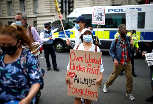 NHS staff members attend a protest asking for a pay rise. File photo: Reuters