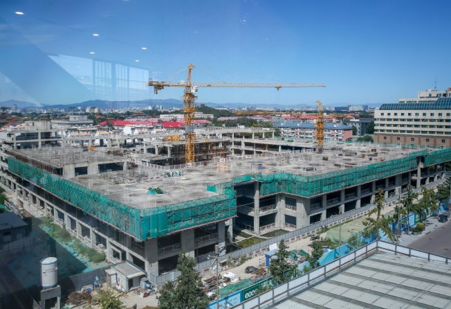 A construction site in Beijing in August 2022. China’s property developers have turned out to be a lot more intertwined with, and connected to, the rest of the economy and the financial system than previously thought. Photo: EPA-EFE