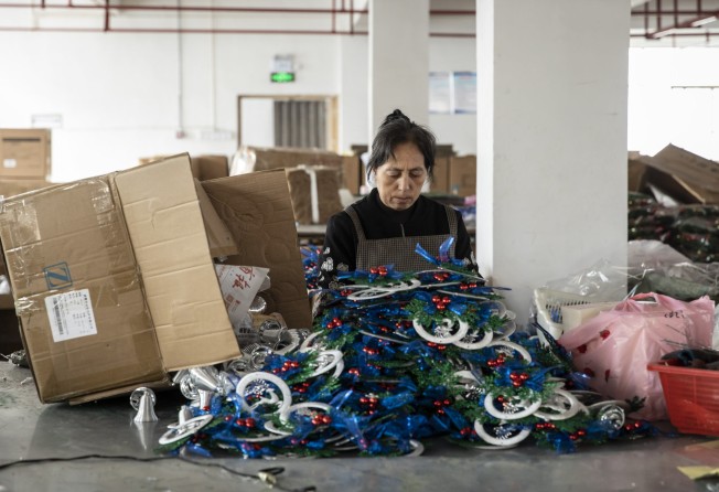 A worker packs Christmas ornaments in a factory in Yiwu, China. Indian exporters say they are starting to get a bigger slice of the festival goods pie. Photo: Bloomberg