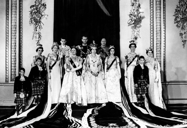 In this shot taken on Queen Elizabeth’s coronation day in 1953, in Buckingham Palace, the queen is flanked by various members of the royal family, including a young Prince William of Gloucester, second from left. Photo: AFP