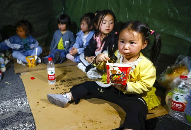 Evacuated children at a temporary shelter in Luding county. Photo: Xinhua