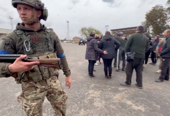 Residents greet soldiers in a location given as Kozacha Lopan, Kharkiv region, Ukraine. Photo: Facebook/Vyacheslav Zadorenko/via Reuters