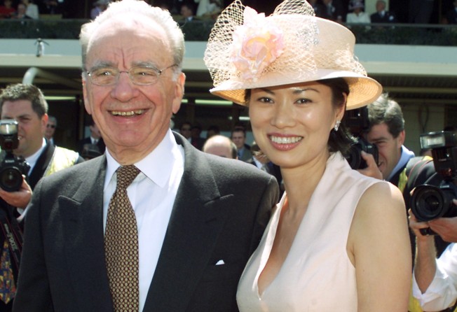 Rupert Murdoch and his ex-wife Wendi Deng in the member’s enclosure at Melbourne’s Flemington Racecourse in November, 2001. Photo: Reuters