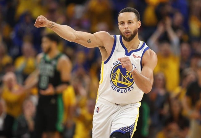 Stephen Curry of the Golden State Warriors celebrates after teammate Andrew Wiggins made a basket and drew a foul during the second quarter against the Boston Celtics in Game Five of the 2022 NBA Finals at Chase Center on June 13, in San Francisco, California. Photo: AFP