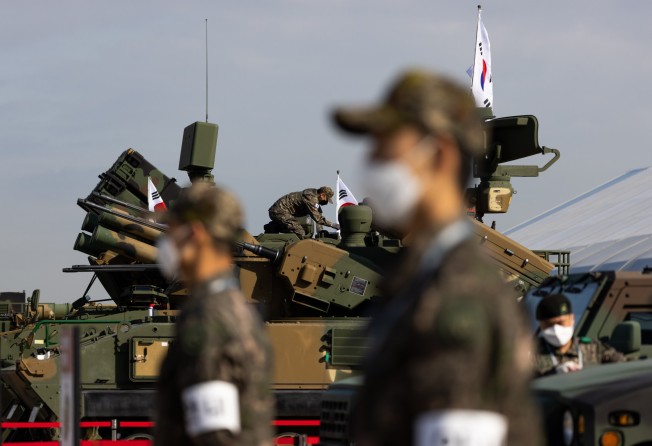 South Korean army soldiers prepare for a display of armoured vehicles at the Seoul International Aerospace & Defense Exhibition (ADEX) at Seoul Airport in Seongnam, South Korea, on October 18, 2021. Photo: Bloomberg