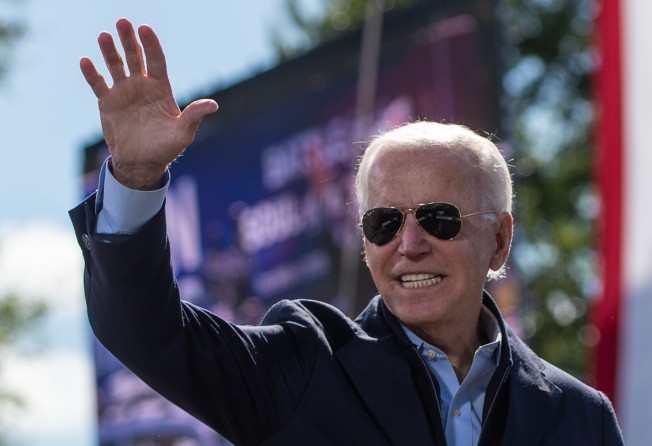 Joe Biden smiles as he acknowledges the crowd at the end of his speech a high school in North Carolina during a campaign stop in October 2020. Photo: AFP