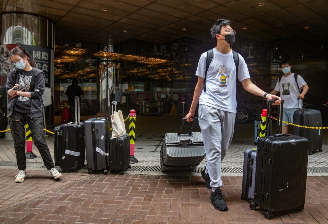 Arrivals at a designated quarantine hotel in Tsim Sha Tsui. Photo: Sam Tsang