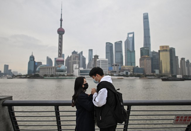 A couple visits the promenade on the Bund in Shanghai. Demographic changes in China have been dramatic thanks to strong state intervention. Photo: AFP