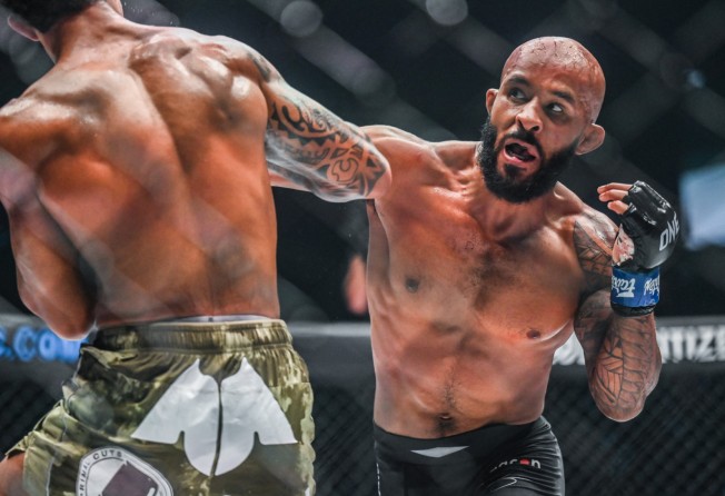 Demetrious Johnson throws a punch at Adriano Moraes at ONE on Prime Video 1.
