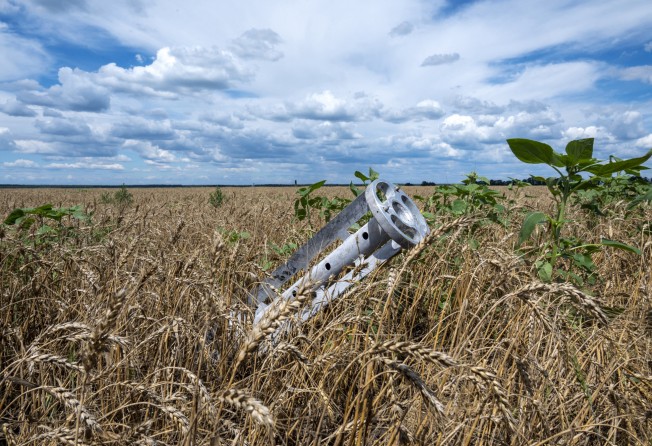 A fragment of a rocket from a multiple rocket launcher is seen embedded in the ground on a wheat field in the Ukrainian Kharkiv region in July 2022. Russia’s invasion of Ukraine has affected global food security. Photo: AFP