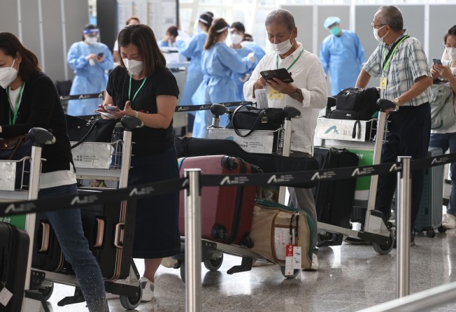 Arriving travellers seen at the Hong Kong airport as the government announces changes to its quarantine policy from September 26. Photo: K.Y. Cheng