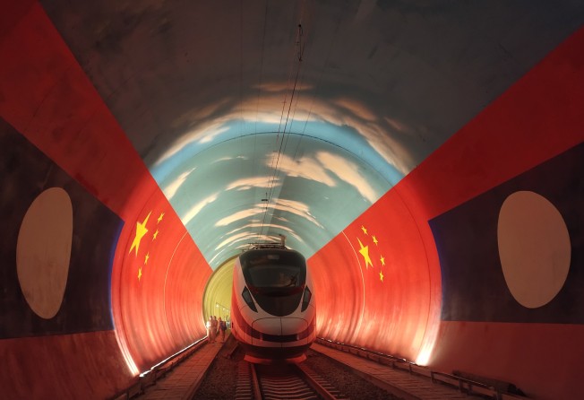 A train passes by the China-Laos borderline inside a tunnel along the China-Laos railway in October 2021. Photo: Xinhua