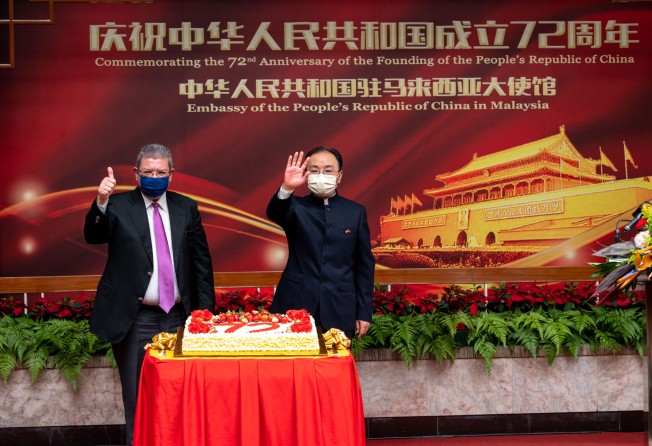 Malaysian Foreign Minister Saifuddin Abdullah (left) and Chinese Ambassador to Malaysia Ouyang Yujing attend an event marking the 72nd anniversary of the founding of the People’s Republic of China hosted by the Chinese embassy in Kuala Lumpur in September 2021. Photo: Xinhua