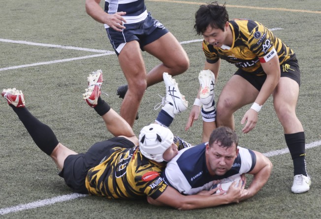 Josh Hrstich scores a try for Football Club as they improved in the second half to beat Tigers. Photo: Jonathan Wong