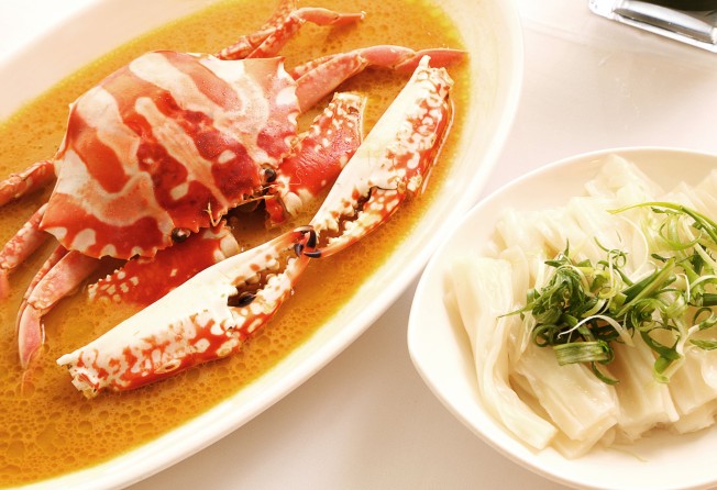 The Chairman’s fresh flower crab with aged Shaoxing wine and chicken fat, alongside a plate of flat rice noodles. Photo: The Chairman