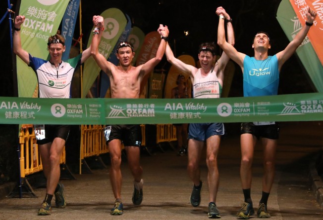 Team Gone Running-Joint Dynamics’ (left to right) Brian McFlynn, John Ellis, Jeff Campbell, and Michael Skobierski win the 2018 Oxfam Trailwalker – the last time the event was held in person before the pandemic. Photo: Felix Wong