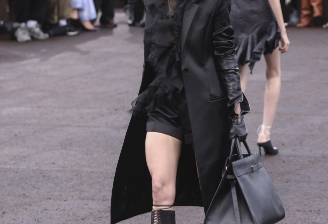 A model wears an all-black creation for the Givenchy ready-to-wear spring/summer 2023 fashion collection presented on October 2, in Paris. Photo: Invision/AP