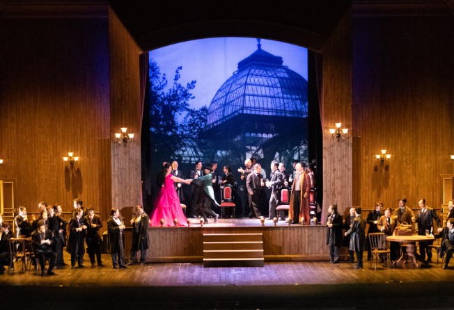 The party at Violetta’s house during Act 1 of Opera Hong Kong’s production of “La Traviata”. Having the whole cast in black evening suits was a nice touch. Photo: Opera Hong Kong