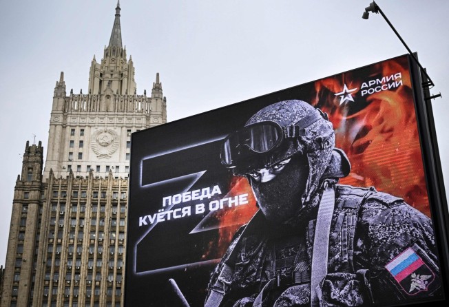A billboard in Moscow shows a tactical insignia of Russian troops in Ukraine, and reading ‘Victory is being Forged in Fire’. Photo: AFP