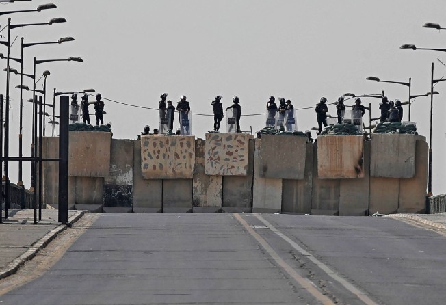 Iraqi security forces block a road leading to the Green Zone in Baghdad. Photo: AFP