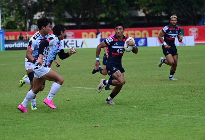 Cado Lee heads for the try line in the semi-final against South Korea. Photo: Handout