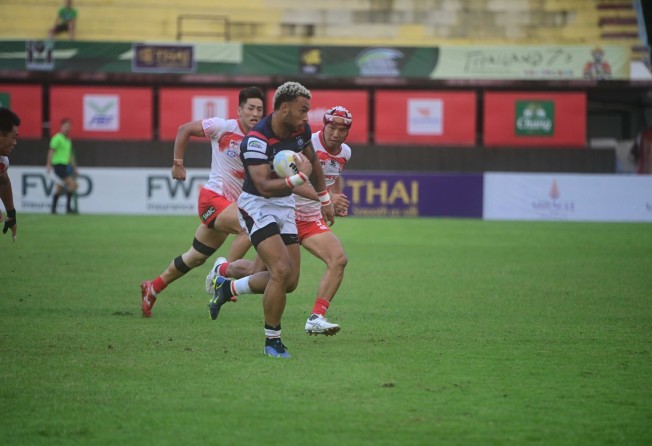 Max Denmark races away for a try against Japan in the final. Photo: Handout