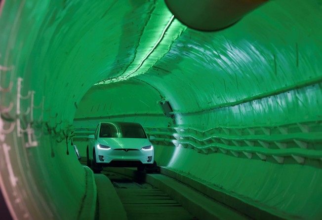 A modified Tesla Model X drives into the tunnel entrance before an unveiling event for The Boring Company Hawthorne test tunnel in Hawthorne, California, US, in December 2018. Photo: Reuters