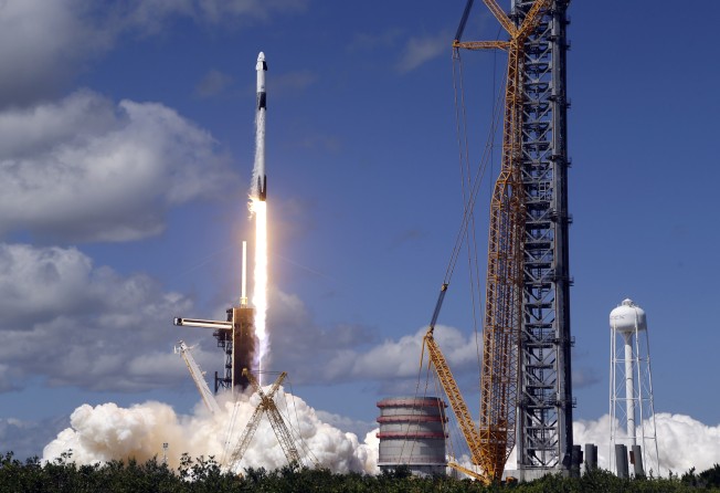 A SpaceX Falcon 9 rocket carrying a Crew Dragon capsule lifts off from Pad 39A at the Kennedy Space Center at the Kennedy Space Center in Cape Canaveral, Florida, on October 5, for a mission to the International Space Station. Photo: AP Photo