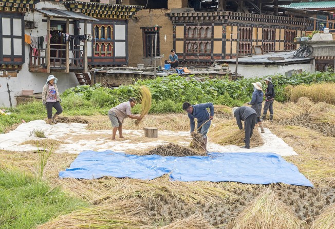 Farmers work along the Trans Bhutan Trail. Photo: Tim Pile