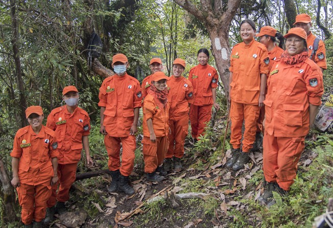 Members of the De-suung, or Guardians of Peace – a 30,000-strong volunteer force tasked with, among other things, maintaining the Trans Bhutan Trail. Photo: Tim Pile