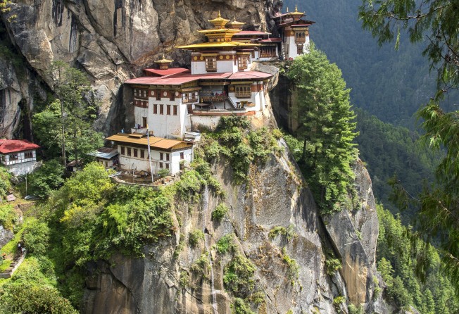 Monks on the approach to the Tiger’s Nest monastery. Photo: Tim Pile