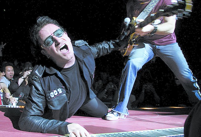 Bono performing with U2 at Los Angeles’ Staple Centre, in 2001. Photo: Getty Images