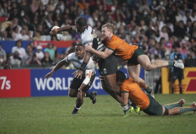 Australia’s Henry Hutchison tackles Fiji’s Josua Vakurinabili in the Cup final. Photo: Sam Tsang