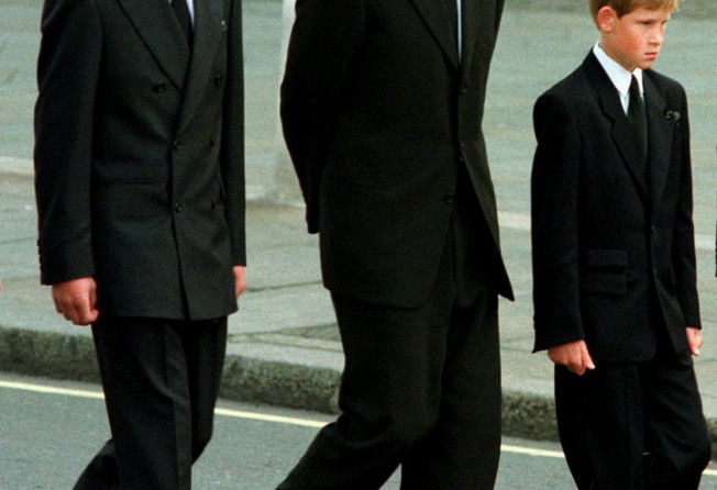 Prince William, Earl Spencer and Prince Harry walk together at the funeral procession for Princess Diana in 1997. Photo: AP
